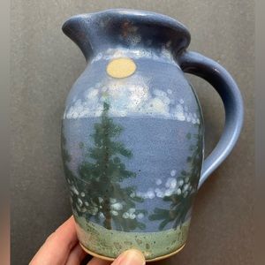 Vintage handmade wood scene pottery pitcher.